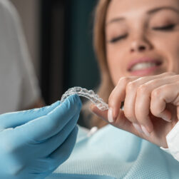 attentive-dentist-demonstrating-aligner-aligner-in-2024-10-18-05-02-00-utc